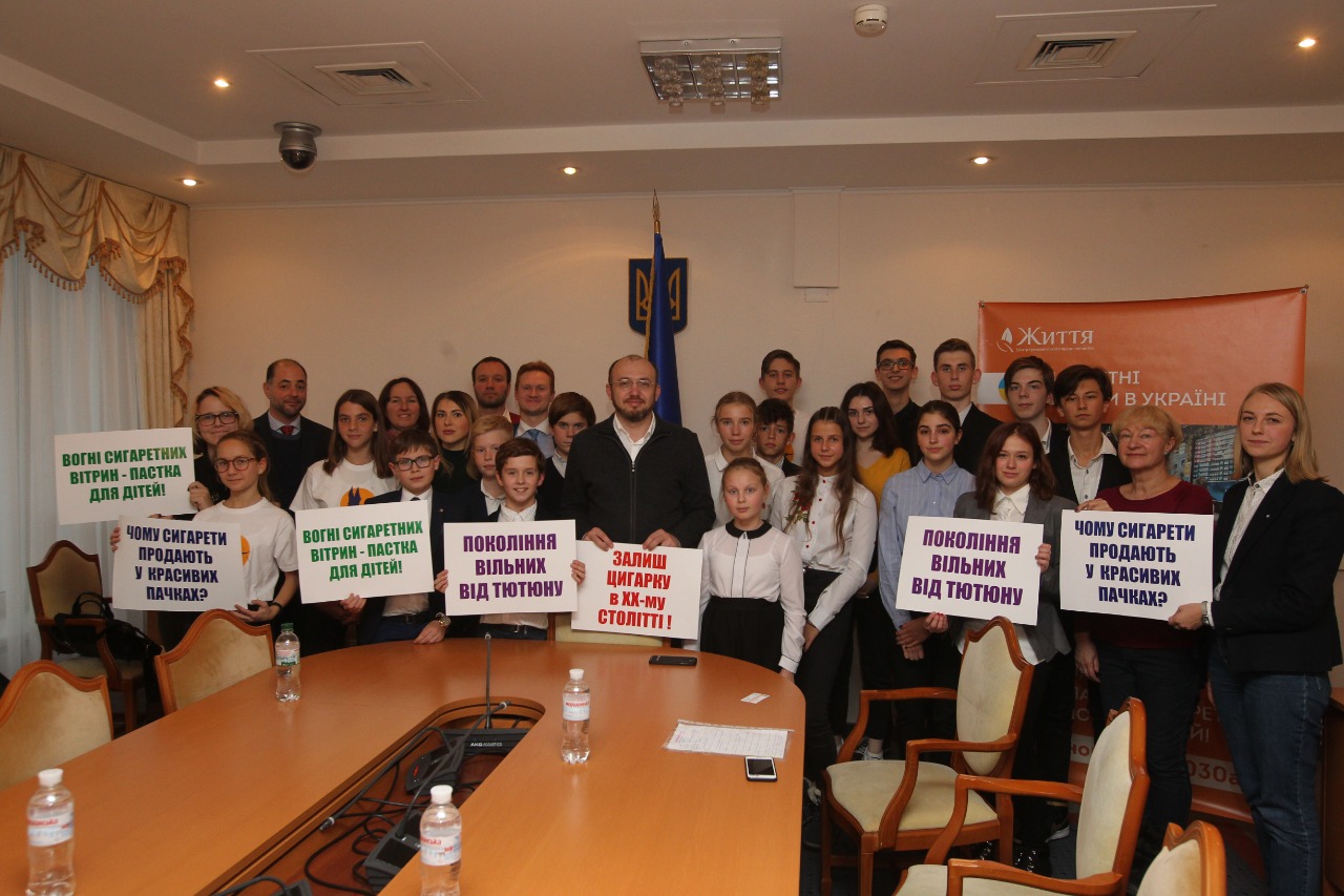 Young people in Ukraine were instrumental in supporting policymakers who successfully promoted the 2022 tobacco control legislation. Sign translations include: “For tobacco free generations”, “Why are cigarettes sold in attractive packaging?!” and “The lights of tobacco kiosks are attractive to kids”. Photo credit: Life Advocacy Center, Ukraine